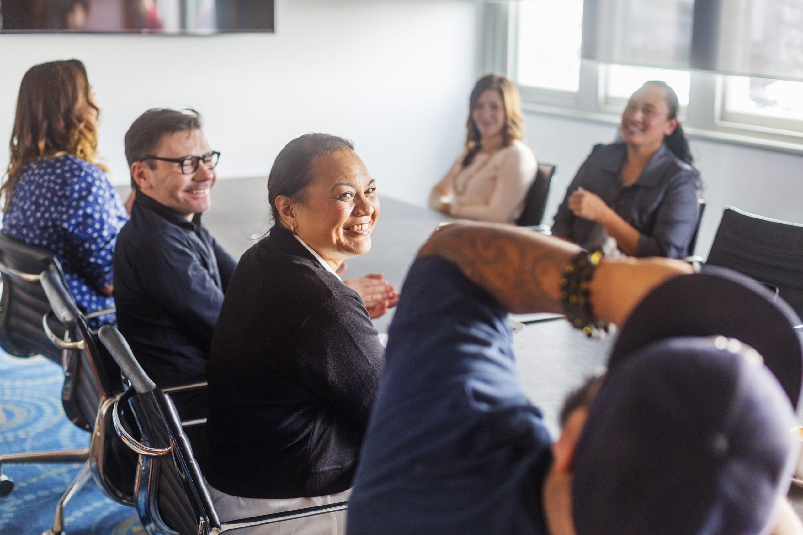 Group of learners at a H&S training course Successful Maori Pacific Islander business woman leading a team of start up entrepreneurs in a corporate business meeting in New Zealand